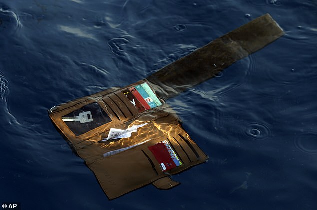 A wallet found floating in the ocean as part of a debris field close to where the jet crashed