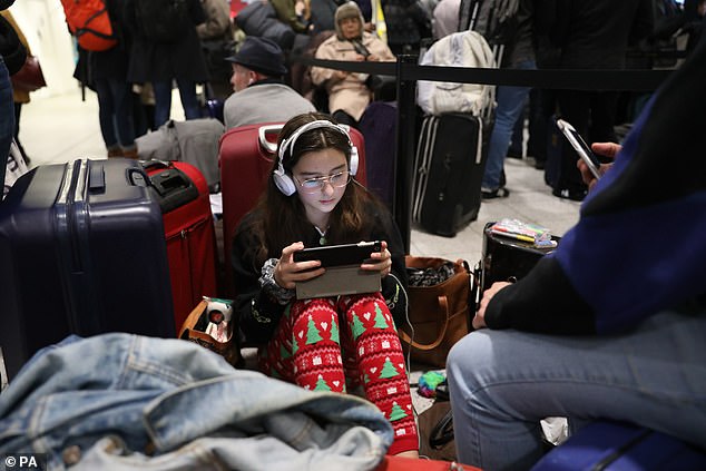 Passengers trying to get home for the festive season were trapped in the airport and on planes as police were called in