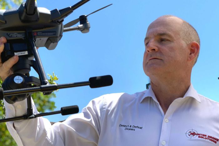 Mr Hildebrand holds a drone.