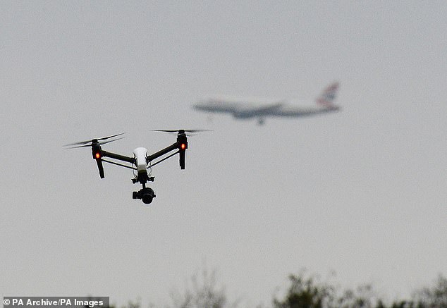 Aircraft pilots are reporting two near-misses with drones every week,  a Daily Mail investigation has revealed