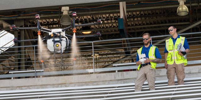 Drone operators are practicing inside the Cotton Bowl stadium, waiting for FAA approval.