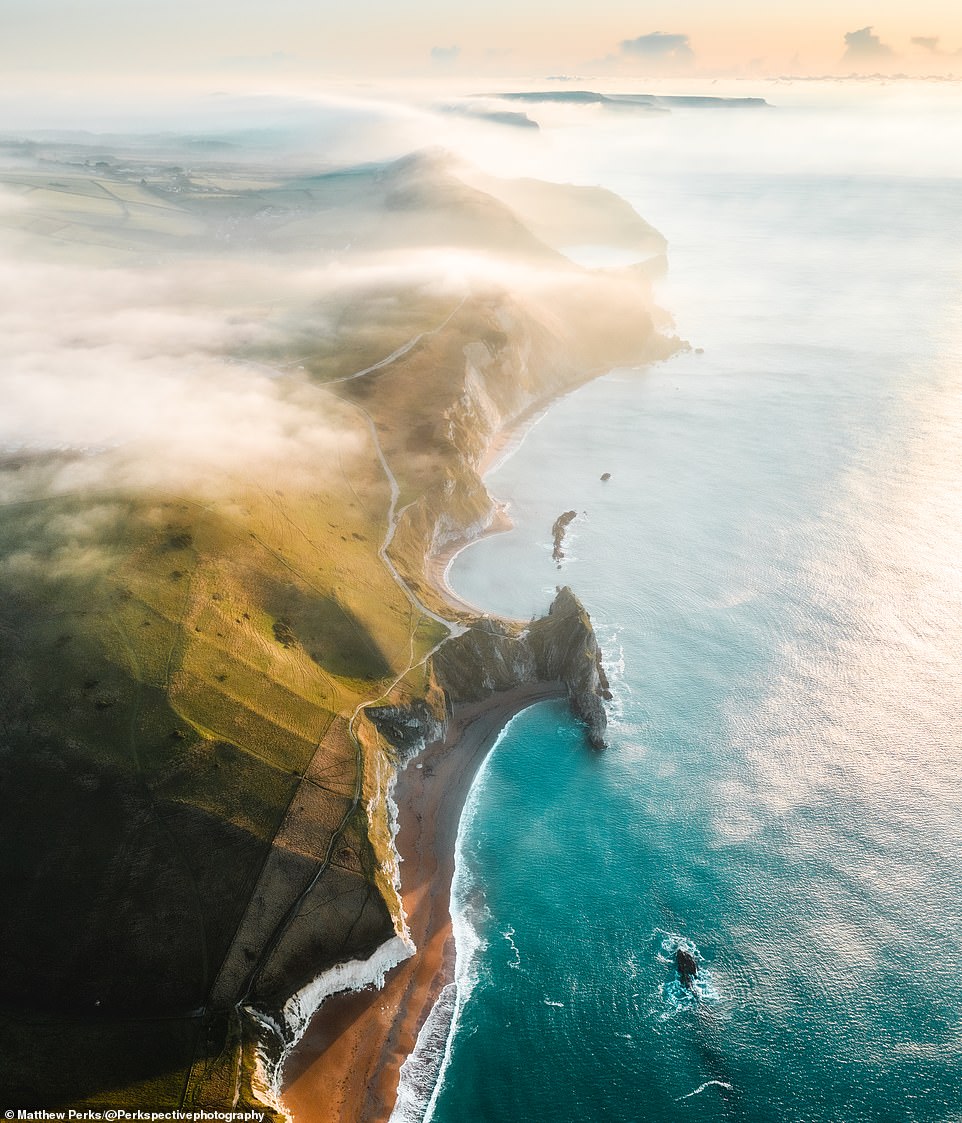 A mesmerising shot of a mist-enveloped Jurassic Coast near West Lulworth, with the mysterious natural arch known as Durdle Door in the foreground. This image has had nearly 700 likes on Matthew's Instagram profile