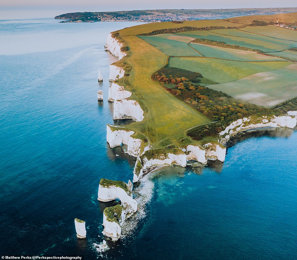 A stunning shot of the Old Harry Rocks chalk formations on the Isle of Purbeck peninsula in Dorset. This spot is on the eastern end of the Jurassic Coast World Heritage Site, which stretches 96 miles to Exmouth in the opposite direction