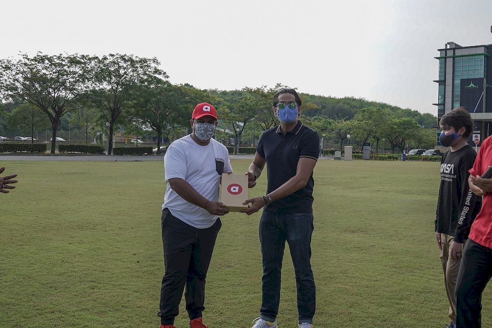 Tan Sri Tony Fernandes (left) and Science, Technology and Innovation Minister Khairy Jamaluddin were present at the recent drone delivery demo. — Picture courtesy of MaGIC