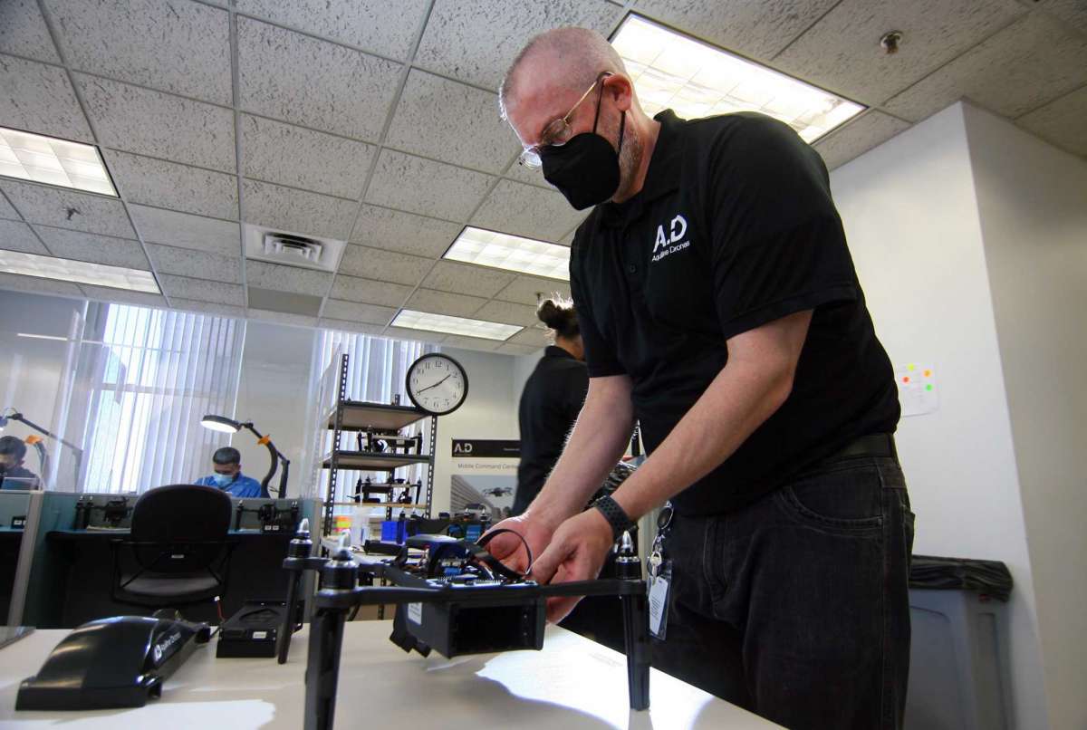Production supervisor Joseph Gates assembles a drone at Aquiline Drones' headquarters at 750 Main St., in downtown Hartford, Conn., on Tuesday, March 30, 2021.