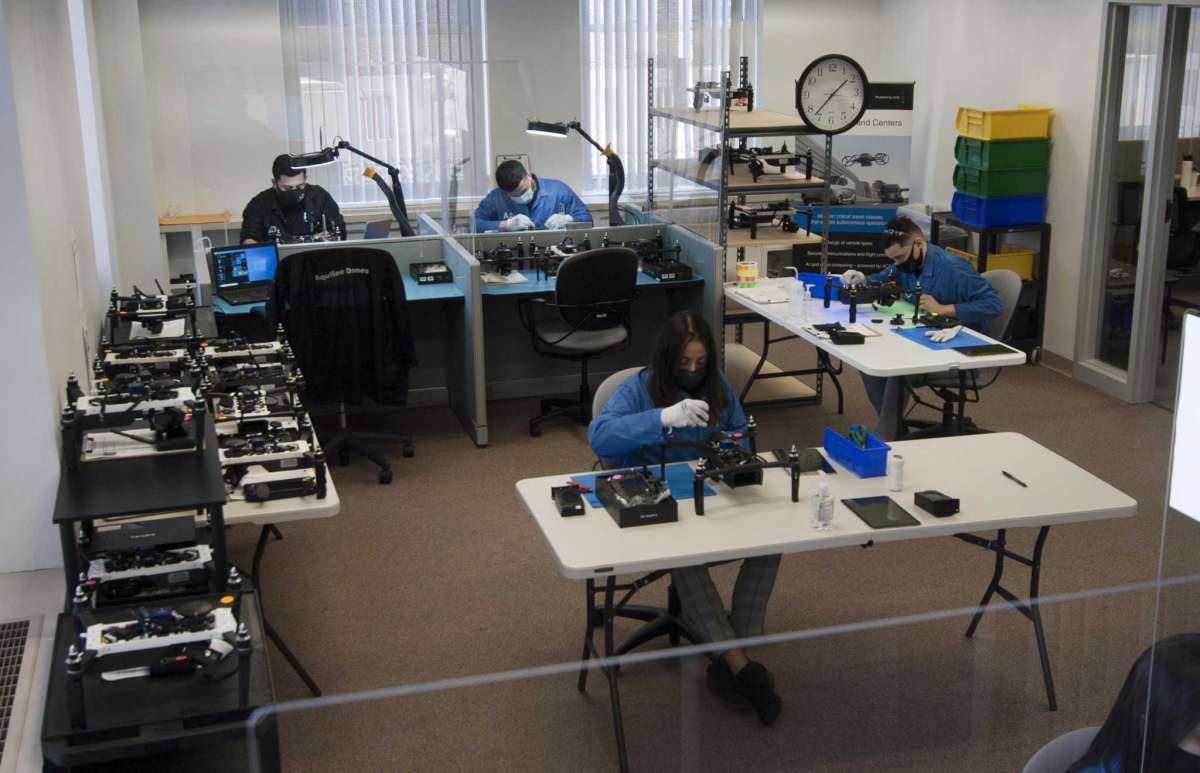 Aquiline Drones technicians work on drones in the company's headquarters at 750 Main St., in downtown Hartford, Conn., on Tuesday. March 30, 2021.