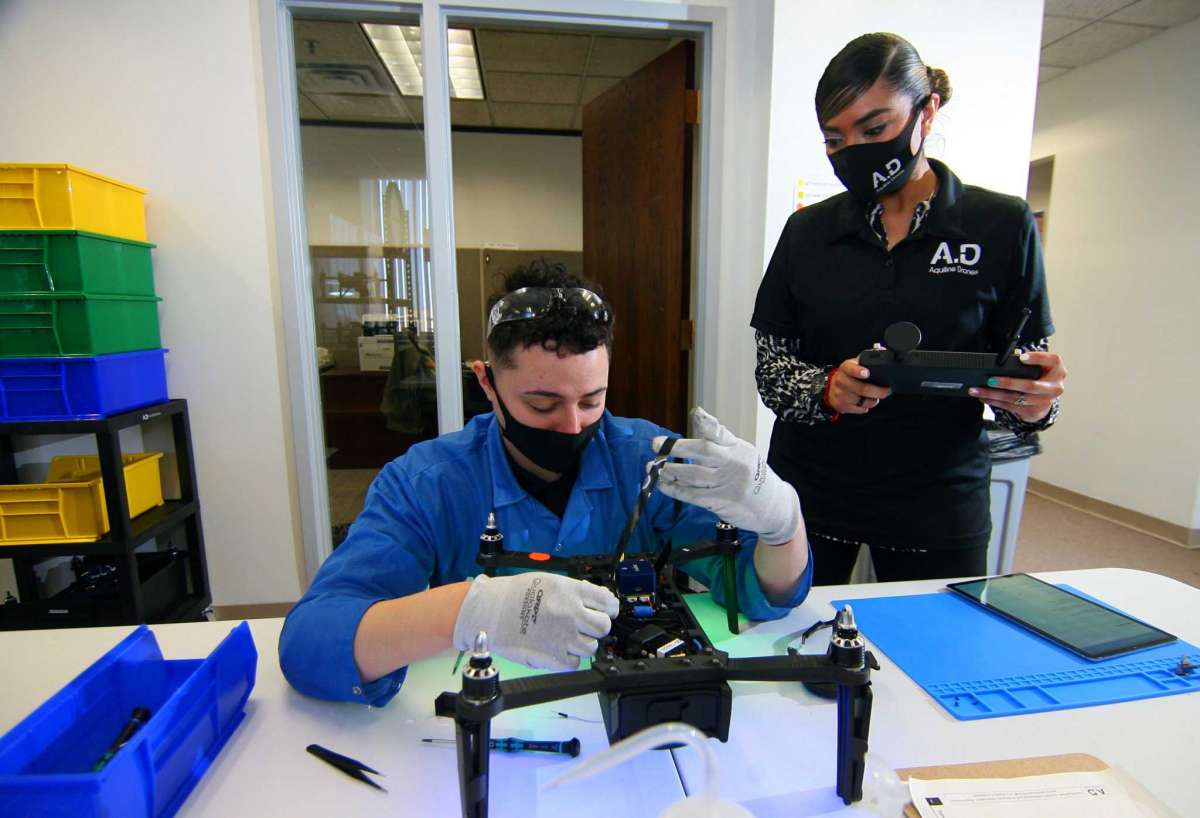 Aquiline Drones employee Brandon Figueroa assembles a drone as supervisor-lead Technician Stephanie Hernandez looks on at the company's headquarters at 750 Main St., in downtown Hartford, Conn., on Tuesday, March 30, 2021.