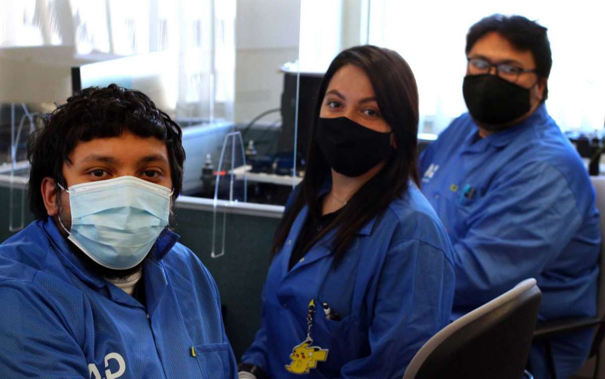 Aquiline Drones technicians Darrian Carrion-Rosa, left, Bridgitte Velez and Phat Dang at work at the company's headquarters at 750 Main St., in downtown Hartford, Conn., on Tuesday, March 30, 2021.