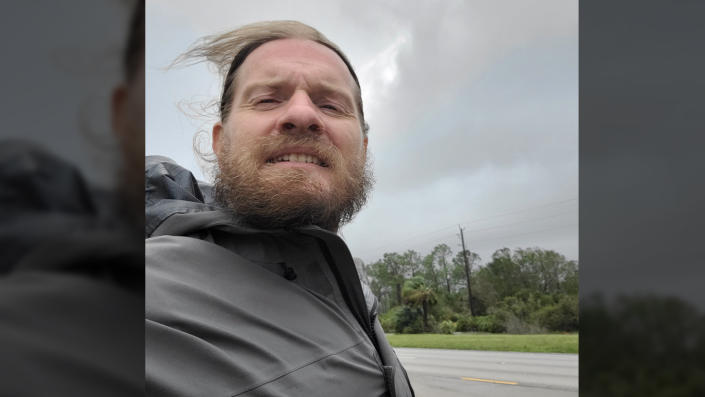 MyRadar weather storm chaser Aaron Jayjack poses for selfie in what he says is the eye of Hurricane Ian.