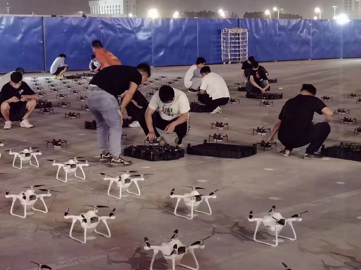 Company staff work on drones for a light show at the Hainan International Convention And Exhibition Center in Haikou City, south China's Hainan Province, April 11, 2023. /EFYI Intelligent Control Technology 