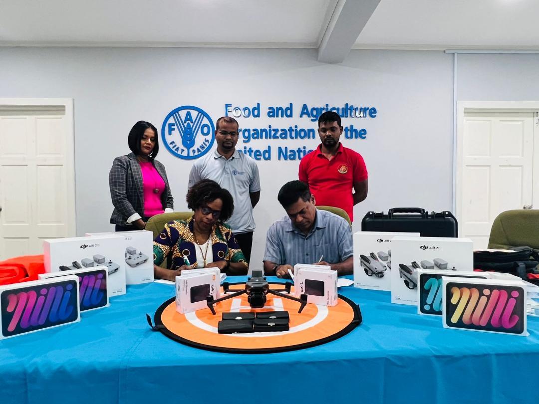 The FAO hand over five drones and related software and accessories to the GRDB