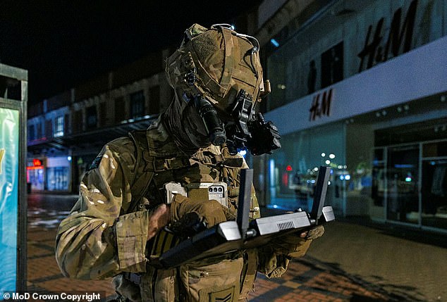 British soldiers are already testing out their own drones. Pictured is a drone pilot from Army's Experimentation and Trials Group during an exercise in Swindon