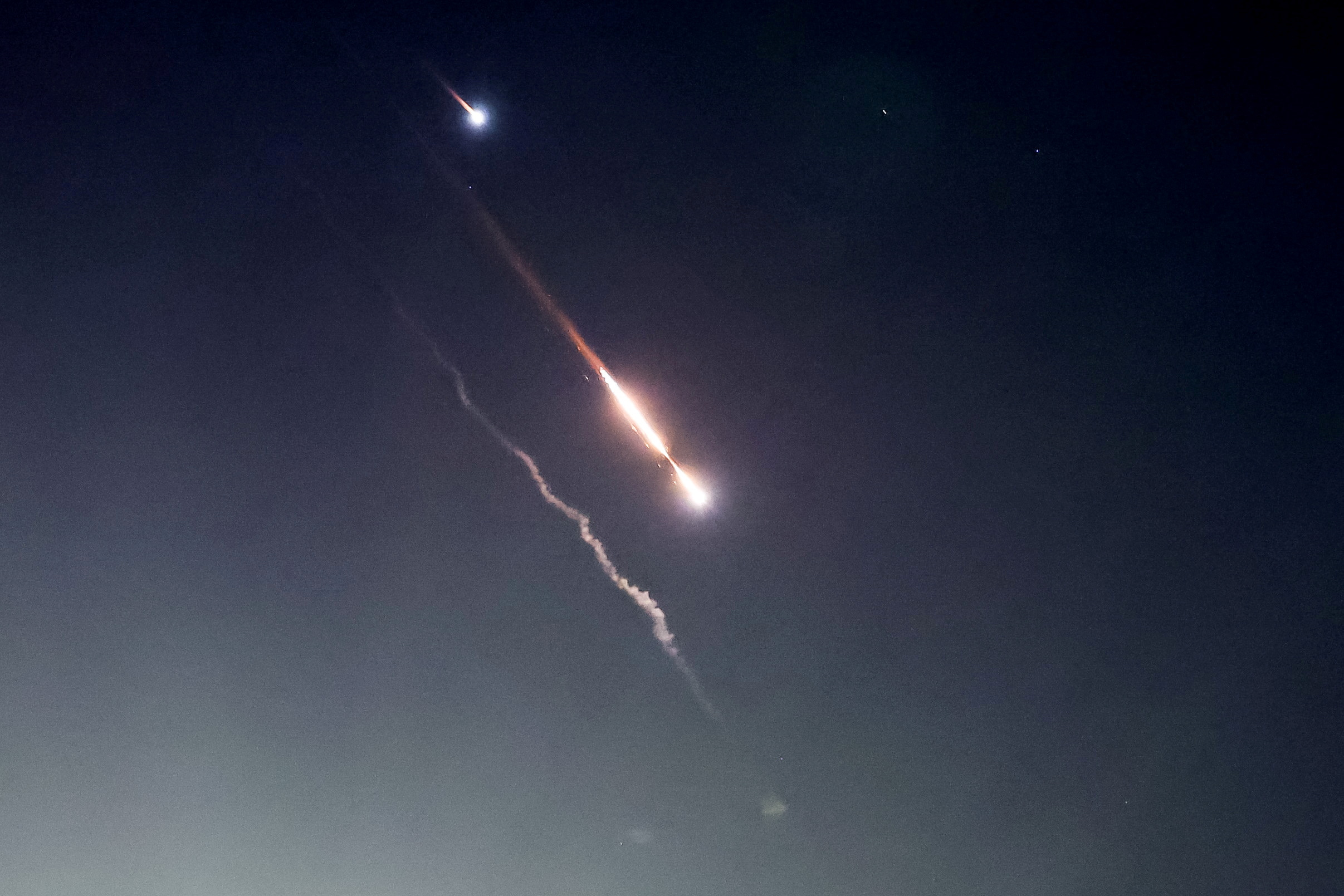 Explosions are seen in the skies above Jerusalem on Saturday night