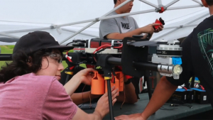 people working on a drone